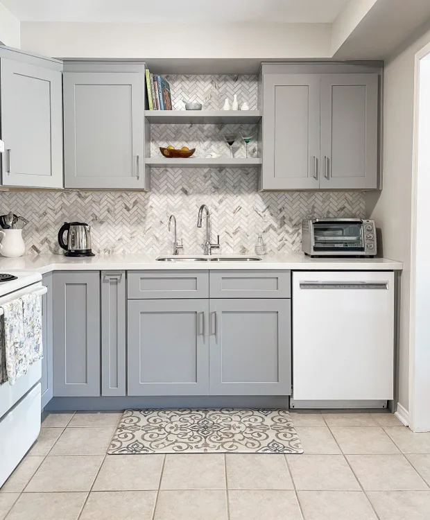Kitchen with gray CabTec Shaker cabinets and open shelving