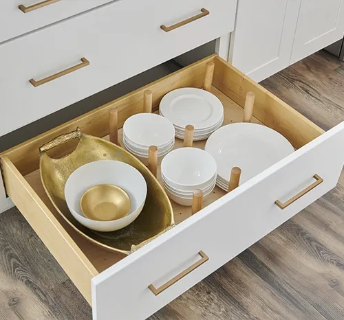 Open Wolf Classic kitchen drawer holding a stack of white bowls